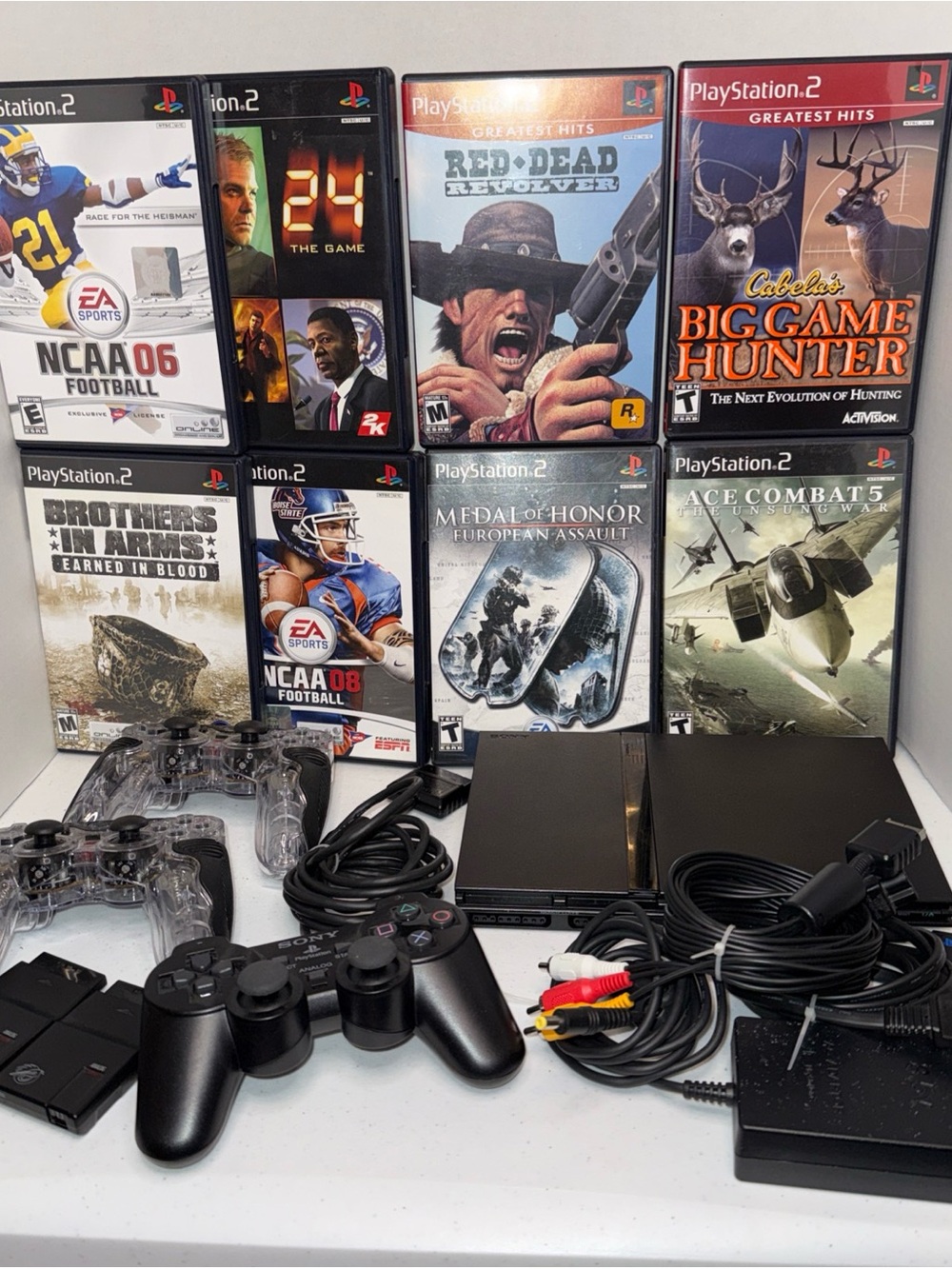 Sony PlayStation 2 Slim Console Bundle in Black with games and Controllers